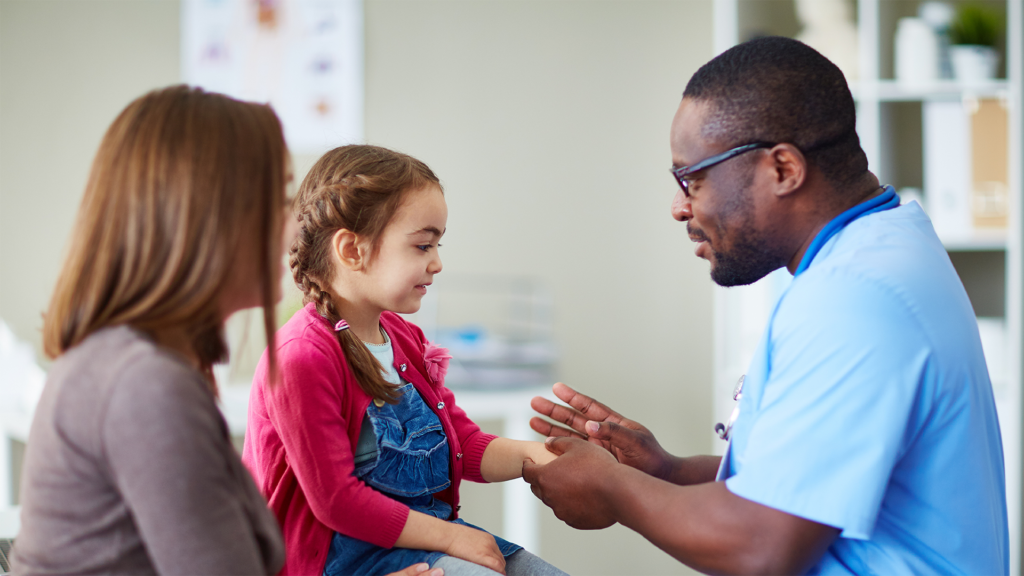 Mom with daughter being treated by doctor