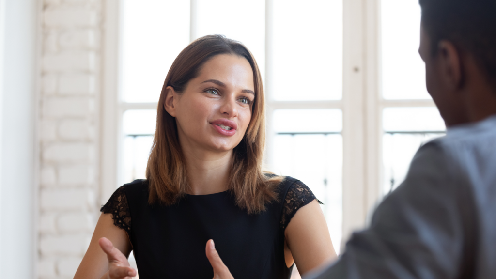 Woman explaining her point to a man